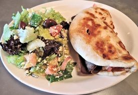 salad and spicy beef in pita bread