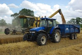 harvesting with a tractor and a combine