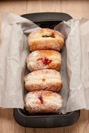 jelly donuts in baking pan