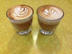 two cups cappuccino with froth