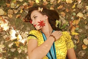 girl with earrings of autumn leaves