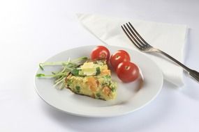 Baked cake and tomatoes