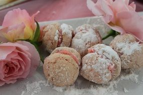 biscuits in powdered sugar near the rose