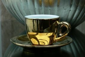 luxury gold cup of coffee closeup