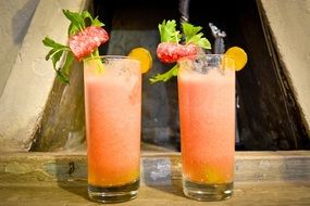 two fruit cocktails in glass cups