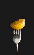 piece of potato on a fork
