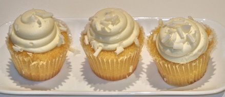 three muffins with coconut