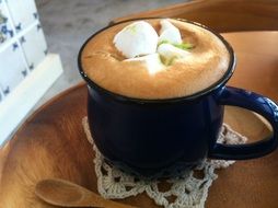 blue cup of coffee with marshmallows