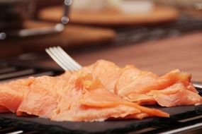 salted salmon slices on a plate