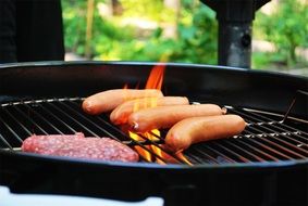 barbecue grill meat on fire