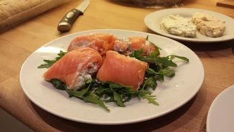 fresh healthy salmon on white plate