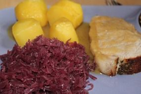 simple dish with potatoes, pork and red cabbage