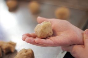 Dough for cookies in the children's hand