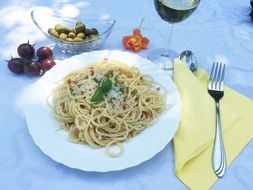 spaghetti in plates and olives