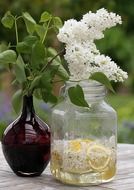 lilac bouquet and lilac syrup in a decanter