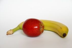 red apple on a background of banana