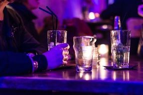 Cocktail glasses on bar table evening