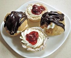 chocolate cream puffs with whipped cream