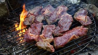 barbecue, meat steaks on grill close-up