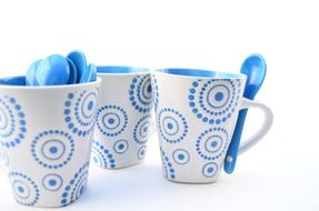 white-blue ceramic cups with spoons