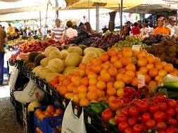 fruits and vegetables on a counter in a market