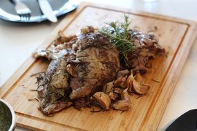 roast with lamb on a board