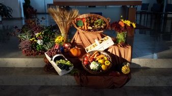 Baskets of vegetables near the flowers