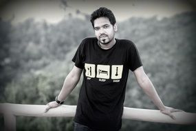 Men in a black tshirt on the bridge