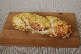 baking with cheese on a wooden board