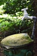 plastic pipe with a tap in the garden in Sri Lanka