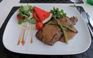 fresh and beautiful pepper steak on a white plate