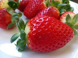 juicy big strawberries on plate