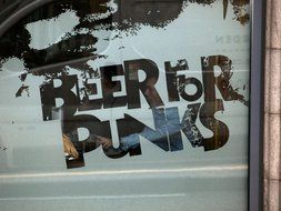 the inscription on the wall in the form of beer and punks