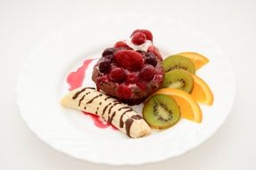 berry dessert with banana and kiwi