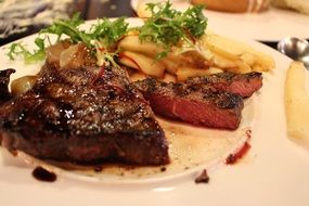 dinner of delicious roasted steak with french fries