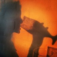 silhouette of a man with a drink as an illustration
