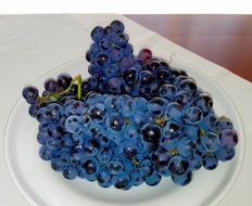 black grapes on plate