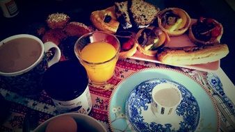 breakfast, coffee and pastries on table