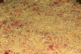 a lot of grated cheese on pizza