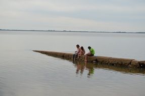 children catch fish