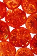 many slices of tomatoes on white