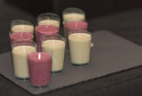 White red smoothie fruit juice in glasses