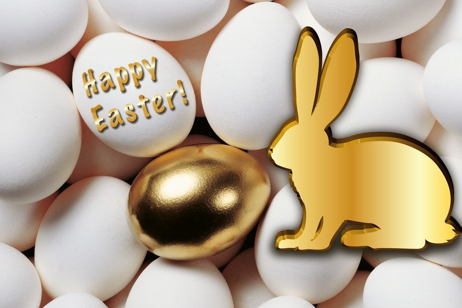 White and gold eggs with a bunny