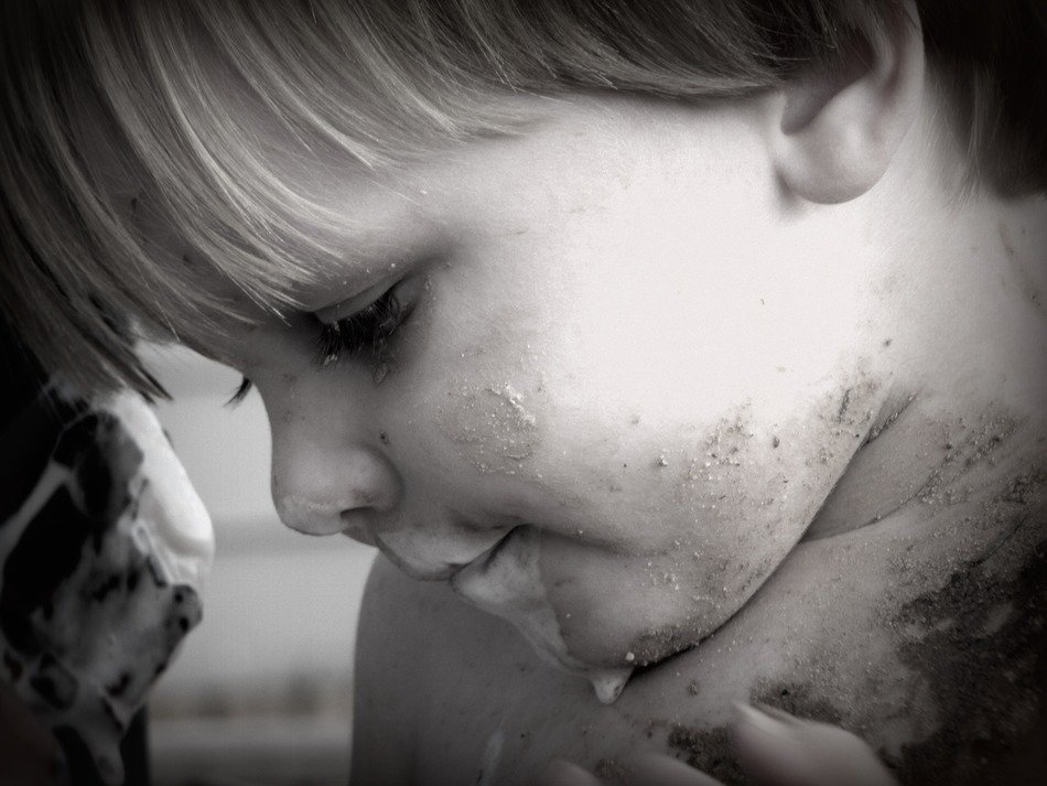 Black and white photo of the muddy boy