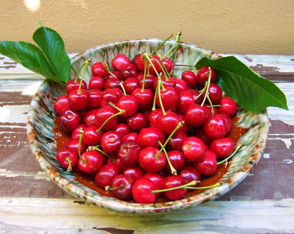 ripe red cherry on dish