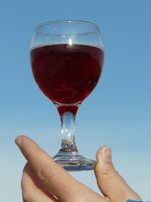 glass of wine in human hands