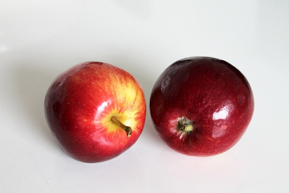 Red apples on the white table