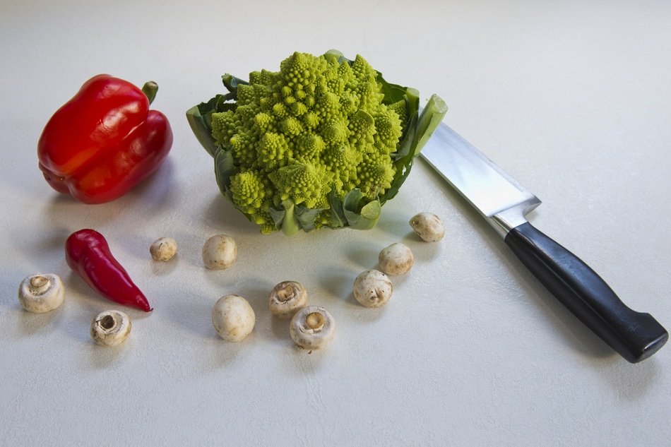 romanesca cauliflower, red pepper, red chile, button mushrooms and chef's knife
