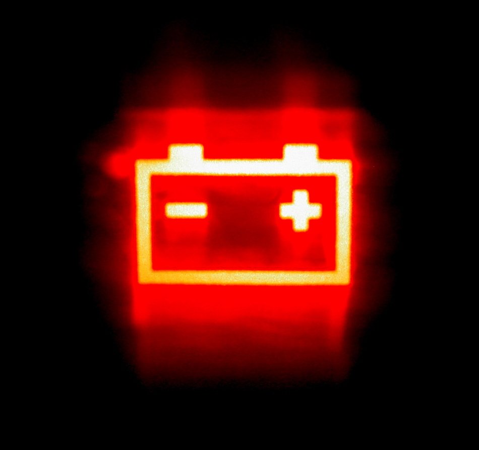 car battery, red drawing at black background