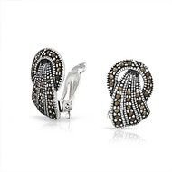 photo of beautiful silver earrings with stones
